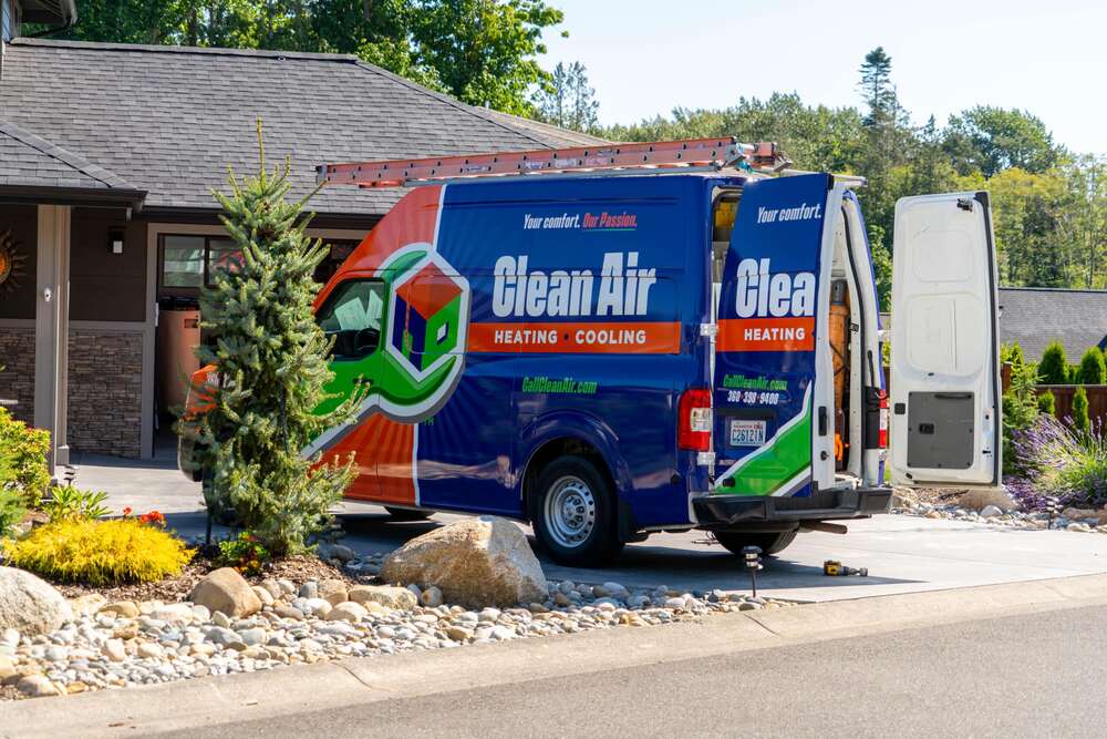 Truck with A Clean Air Wrap In Front of A Home performing air conditioning service in Birch Bay