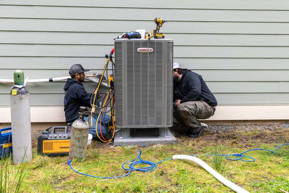 technicians performing regular hvac maintenance or air conditioning service