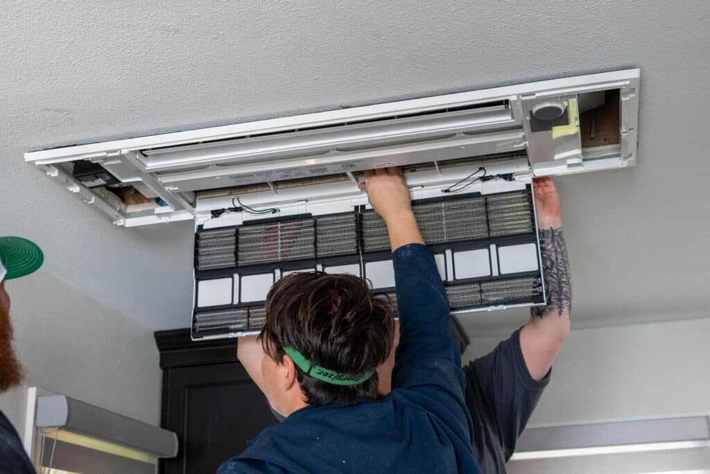 Technician installing a wall-unit